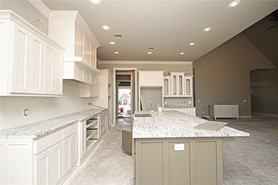 Great backsplash, double ovens and 5 burner gas co