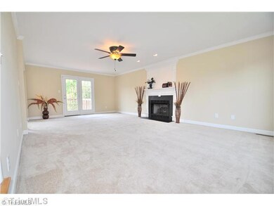 Den/Family/Great Room. Sunny and spacious Great Room features a gas log fireplace and opens to the back deck.