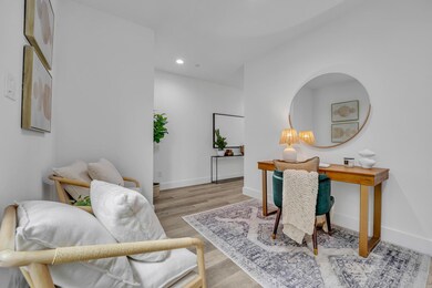 Office featuring baseboards, wood finished floors,