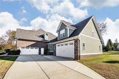 2 attached garages, one 2 Car side load garage and