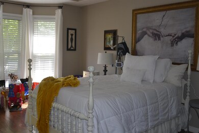 This is one of two Master Bedrooms & is located downstairs. Enjoy laminate flooring & trey ceiling