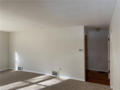 View from living room to hallway that leads to bed
