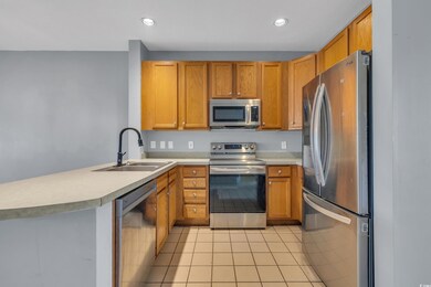 Kitchen with kitchen peninsula, appliances with st