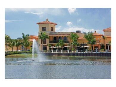 Picturesque view over lake and fountain to another restaurant with outside cafe.