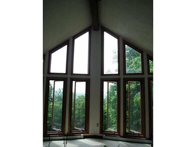 Living Room. Large windows make this room bright a
