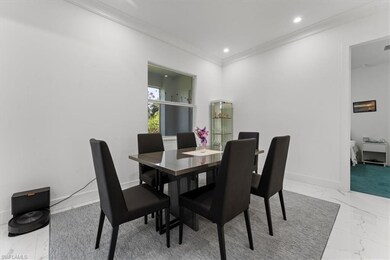 Dining space with marble finish flooring, ornament