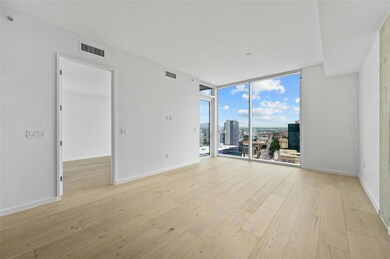 Unfurnished room featuring visible vents, light w