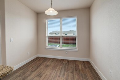 Spare room featuring baseboards, plenty of natura