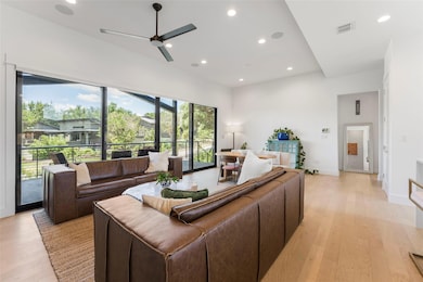 Living area with ceiling fan, recessed lighting, 