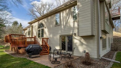 Two tiered cedar deck and brick grilling patio is a wonderful space to unwind and enjoy the beautifully landscaped yard, or entertain guests!