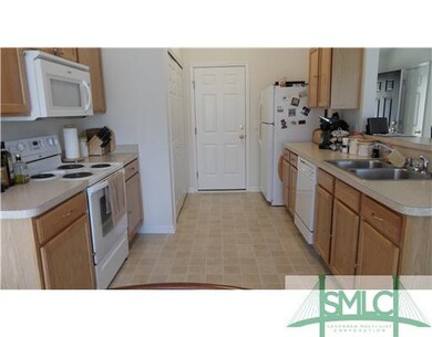 Kitchen. KITCHEN FEATURES AMPLE CABINET/STORAGE. C