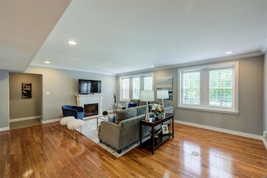 Entry Foyer with coat closet to left.  Electric Fireplace remains with home!