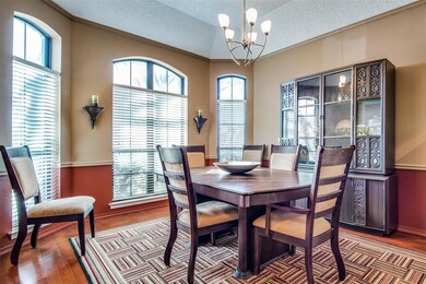 Large formal dining room with wood floor