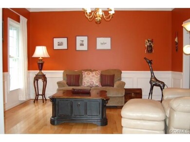 Formal Dining room with hardwood floors, wainscoti