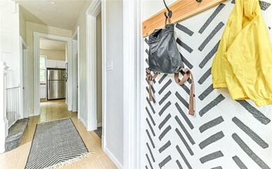 The entry way coming into the home is warm and inv
