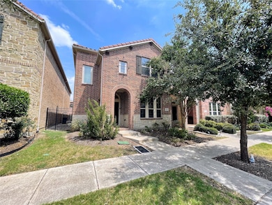View of front of house with brick siding and stone siding