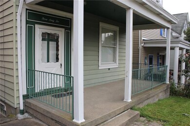 Enjoy coffee on your covered front porch