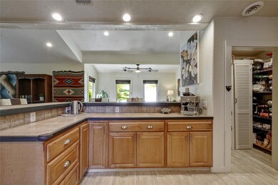 Kitchen with visible vents, ceiling fan, and rece