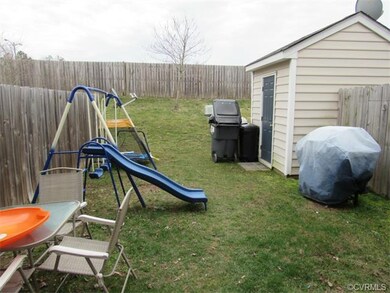 Spacious back yard with storage shed.  Privacy fen