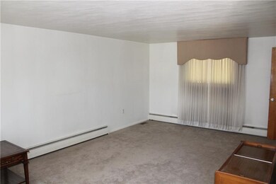 Living room is the depth of the house with neutral