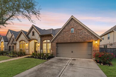 The spacious driveway provides ample parking space