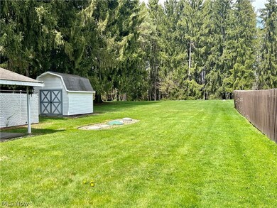 View of yard featuring a storage unit