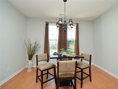 Dining side of great room looks out over patio.