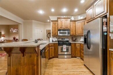 Sleek stainless appliances and hardwood flooring i