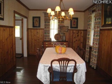 Formal dining room with crown molding and hardwood