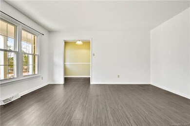 Spacious Living Room overlooking front porch and f