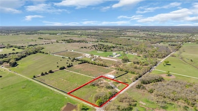 Birds eye view of property with a rural view