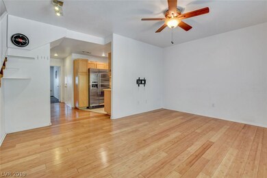 Bamboo flooring and ceiling fan in living room