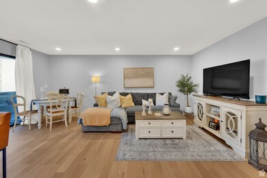Living room featuring light wood-type flooring and recessed lighting