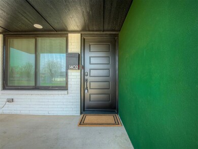 Entrance to property with brick siding