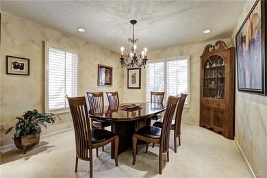 Dining Room with Recessed Lighting and Chandelier