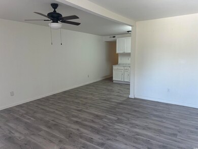 Unfurnished room with dark hardwood / wood-style f