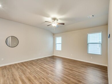 Spare room with ceiling fan, lofted ceiling, and l