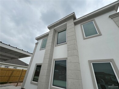 View of side of home featuring stucco siding