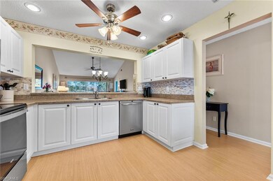 Kitchen featuring backsplash, light wood finished 