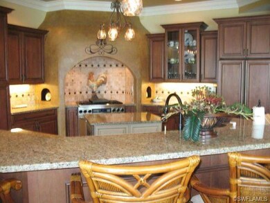 Wrap-around kitchen bar features stool seating for