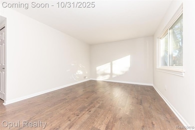 Unfurnished room featuring dark wood-style flooring