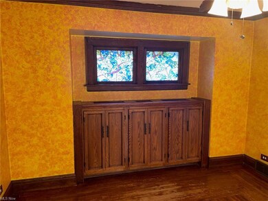 Built-in credenza w/stain glass windows above