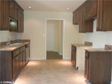 Exterior Front - Kitchen showing custom cabinets a