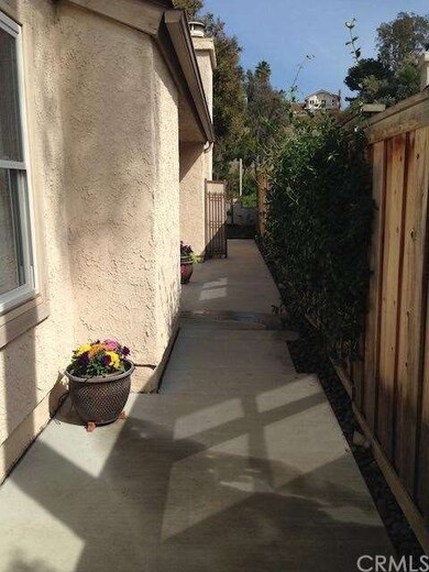 Private Side yard going toward the front door.