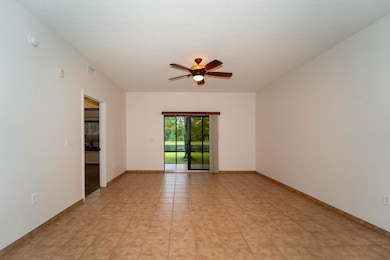 Empty room featuring a textured ceiling and ceiling fan
