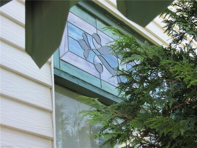 STAIN GLASS WINDOW IN LIVINGROOM