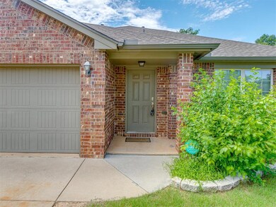 Doorway to property with a garage