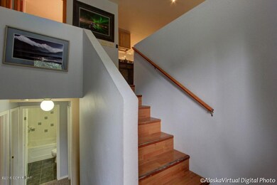 Split Level Entry With Wood Stairs