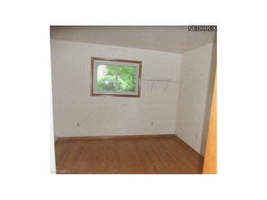 Bedroom 1 features neutral decor, double closet, w