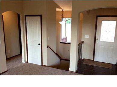 Nice arched entryway with ceramic tile!